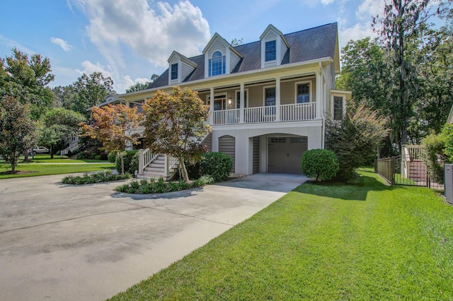 view of front of home with concrete driveway, a porch, stairs, a garage, and stucco siding