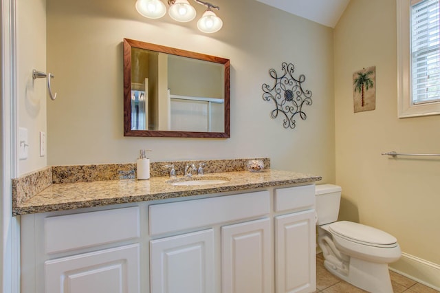 full bath featuring toilet, vanity, tile patterned floors, and vaulted ceiling
