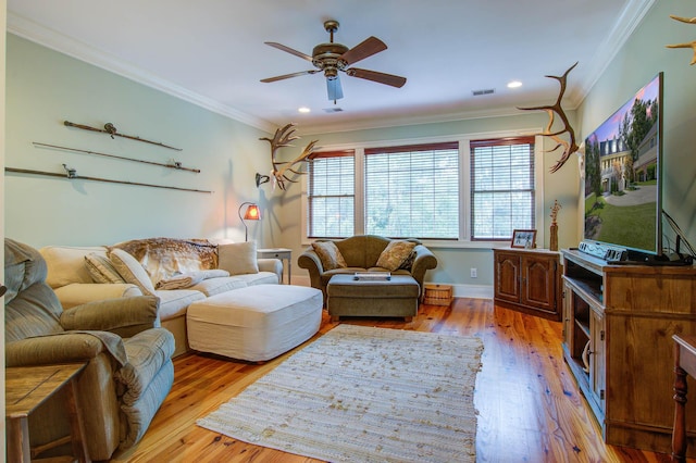 living room featuring hardwood / wood-style floors, ceiling fan, crown molding, recessed lighting, and baseboards