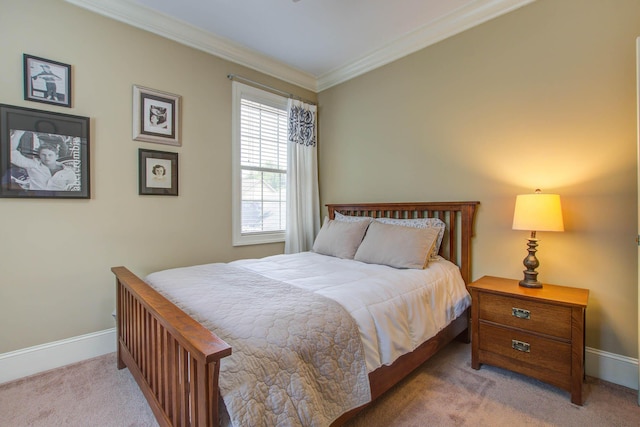 bedroom featuring carpet flooring, baseboards, and crown molding