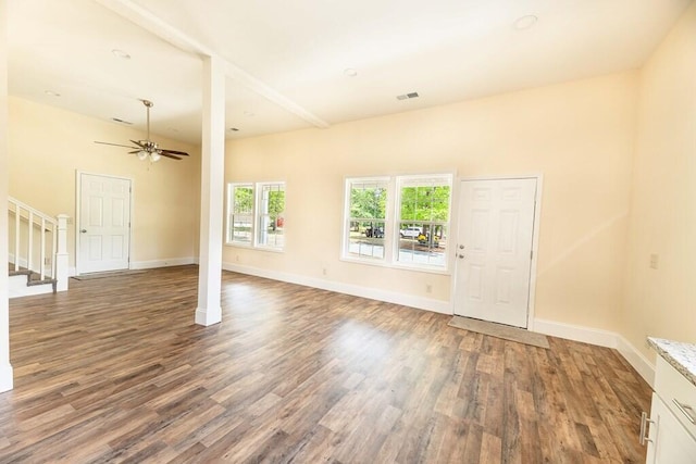 1165 Cleveland St, Elloree, SC 29047 - unfurnished living room featuring wood finished floors, a ceiling fan, stairs, and baseboards