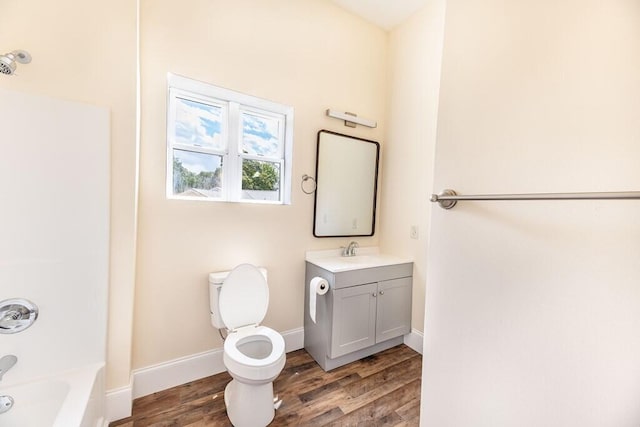 1165 Cleveland St, Elloree, SC 29047 - bathroom with wood finished floors, vanity, toilet, baseboards, and  shower combination