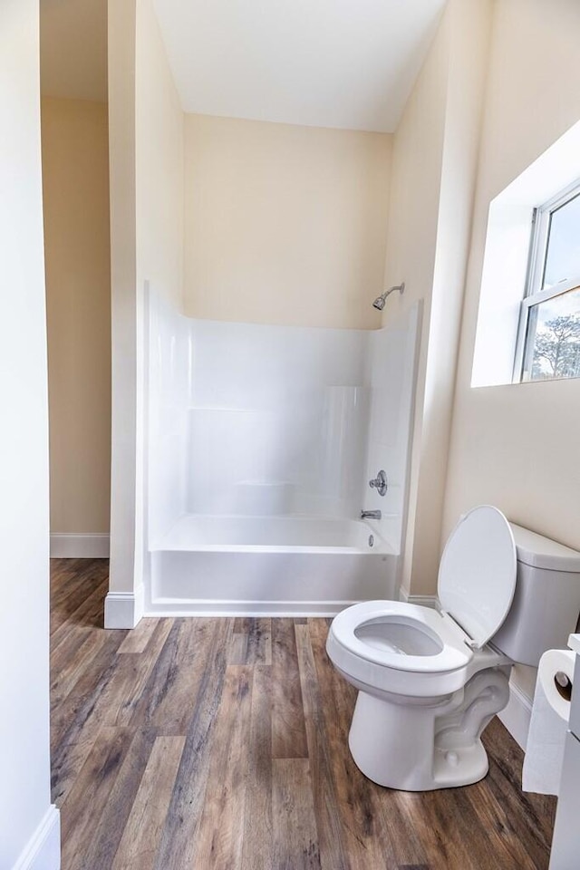 1165 Cleveland St, Elloree, SC 29047 - full bath featuring toilet, wood finished floors,  shower combination, and baseboards