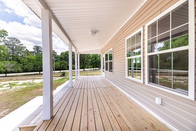 1165 Cleveland St, Elloree, SC 29047 - wooden porch with view of wooded area