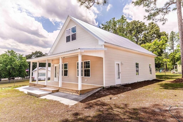 1165 Cleveland St, Elloree, SC 29047 - view of side of property with covered porch and metal roof