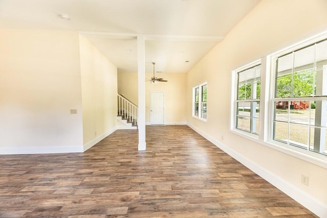 1165 Cleveland St, Elloree, SC 29047 - unfurnished living room featuring wood finished floors, stairs, baseboards, and a ceiling fan