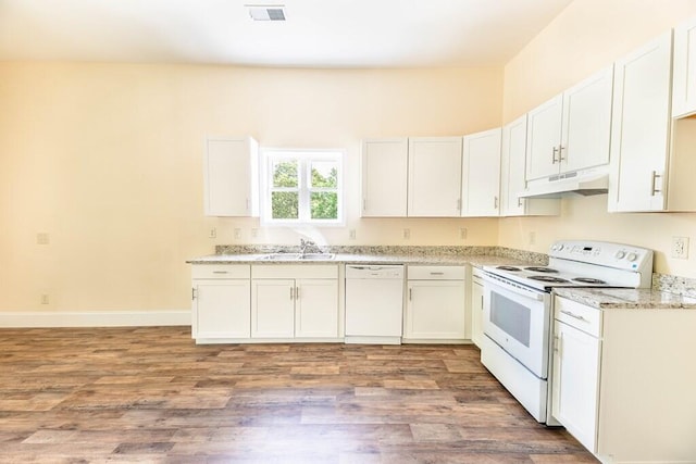 1165 Cleveland St, Elloree, SC 29047 - kitchen with white appliances, a sink, under cabinet range hood, and wood finished floors