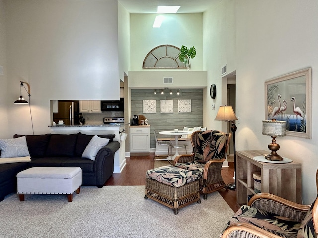 living room with a high ceiling