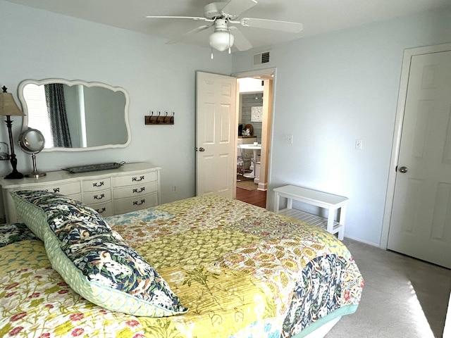 carpeted bedroom with ceiling fan