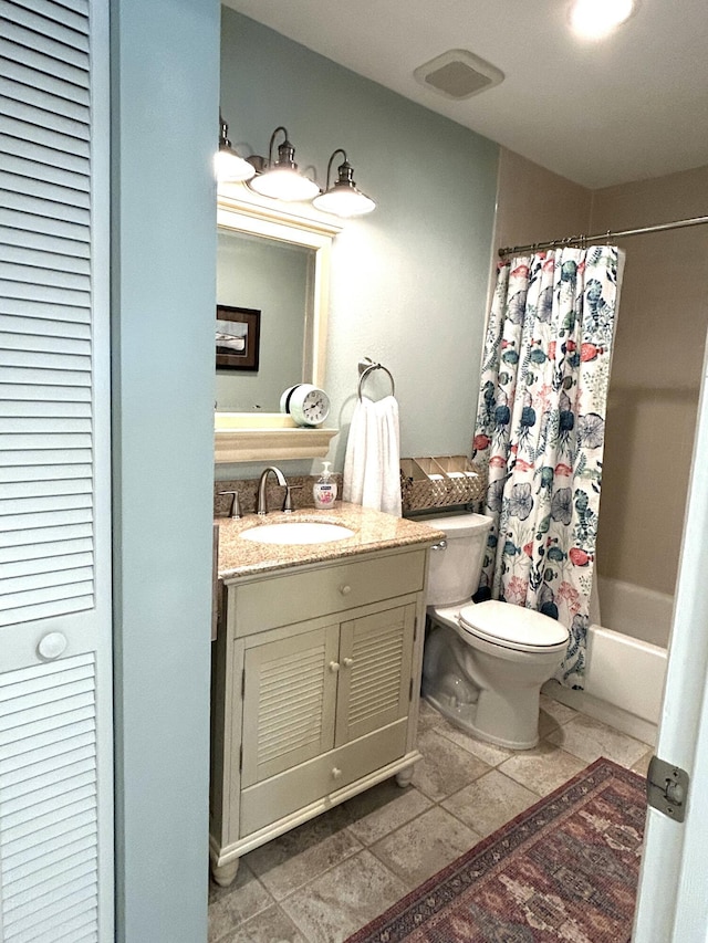 full bathroom featuring vanity, shower / bath combo, and toilet