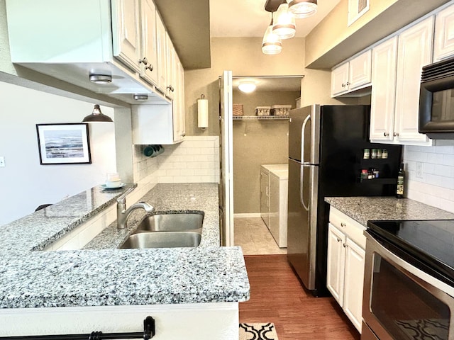 kitchen featuring sink, backsplash, and white cabinets