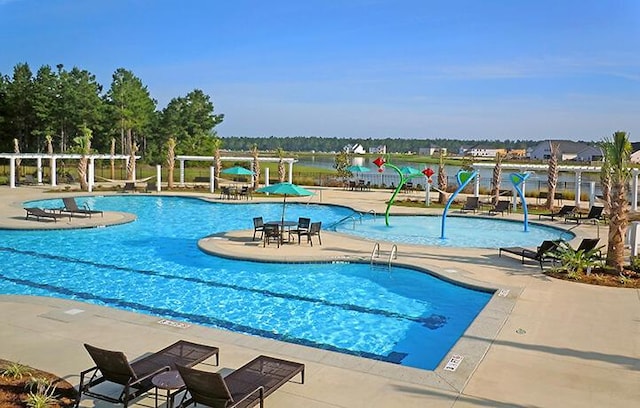 community pool featuring a patio area