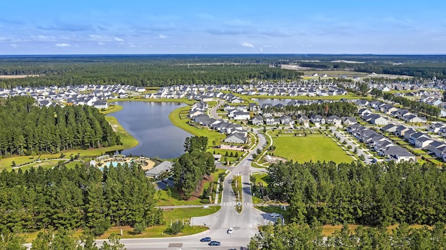 drone / aerial view featuring a water view and a residential view