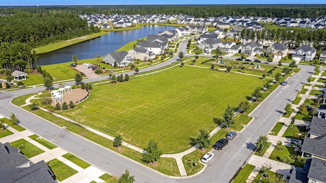 drone / aerial view featuring a water view and a residential view