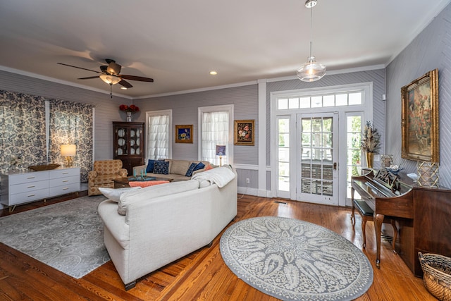 living room with recessed lighting, wood finished floors, ceiling fan, and ornamental molding