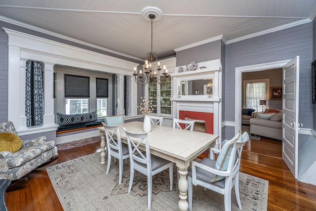 dining space with a chandelier, plenty of natural light, hardwood / wood-style flooring, ornamental molding, and wood ceiling