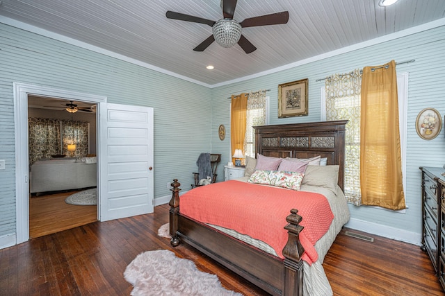 bedroom featuring baseboards, visible vents, ceiling fan, and hardwood / wood-style floors