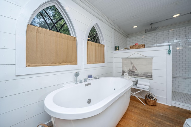 full bath featuring wood finished floors, recessed lighting, walk in shower, and a freestanding bath
