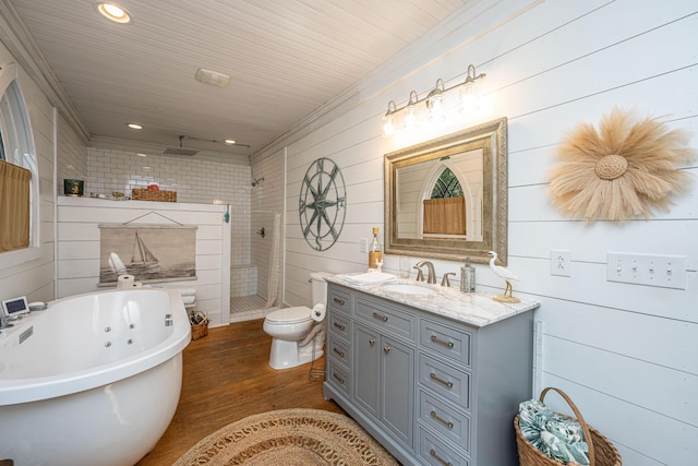 full bathroom with vanity, toilet, a soaking tub, tiled shower, and wood finished floors