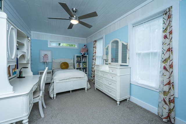 bedroom with crown molding, wooden ceiling, a ceiling fan, light carpet, and baseboards
