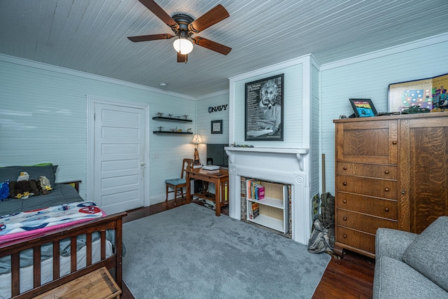 bedroom featuring ceiling fan, wood finished floors, and ornamental molding