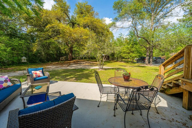 view of patio with an outdoor living space and outdoor dining space