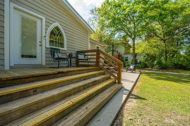 wooden terrace with a yard