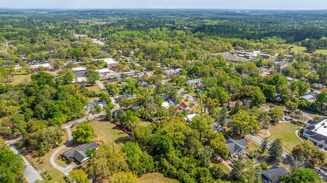birds eye view of property featuring a residential view and a view of trees