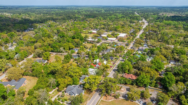aerial view featuring a view of trees and a residential view