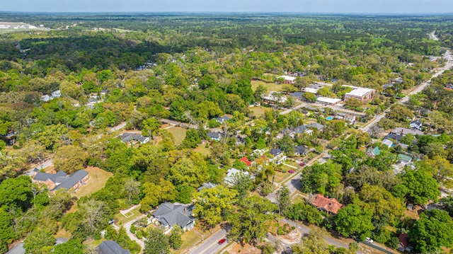 bird's eye view featuring a residential view and a forest view