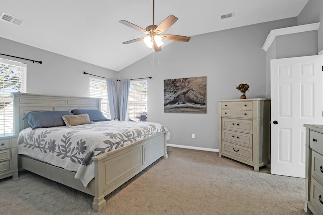 carpeted bedroom with vaulted ceiling and ceiling fan