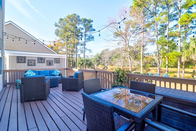 wooden deck with an outdoor hangout area