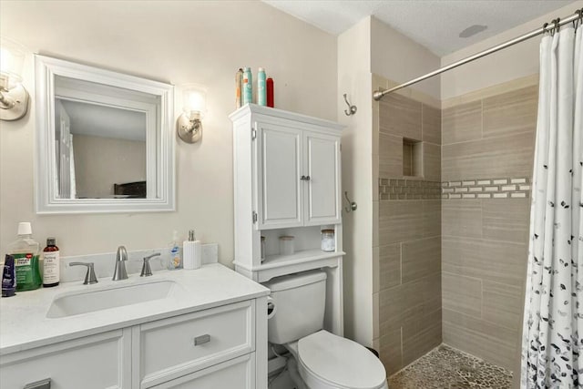 bathroom featuring vanity, a shower with curtain, and toilet