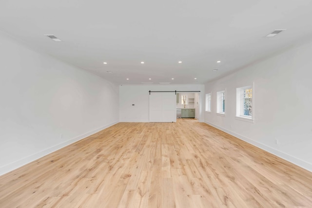 unfurnished living room with light hardwood / wood-style flooring