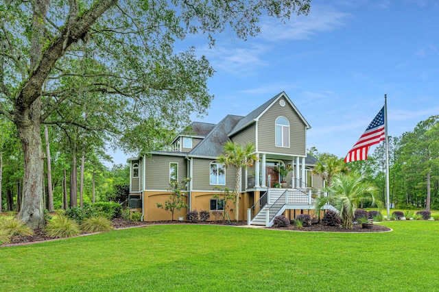 view of front of property with a porch and a front yard