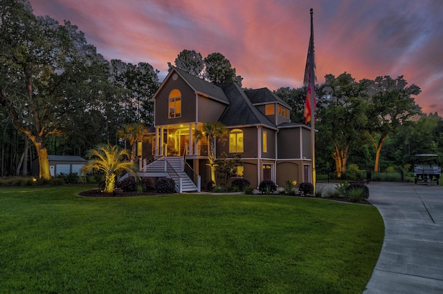 front of property with a yard and a porch