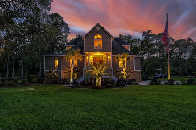 exterior space featuring a porch and a yard