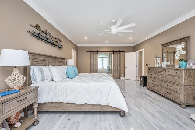 bedroom featuring crown molding, ceiling fan, a barn door, and light hardwood / wood-style floors