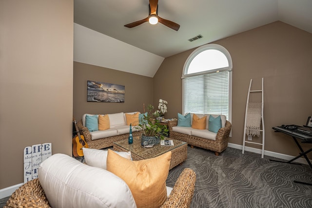 carpeted living room with vaulted ceiling and ceiling fan