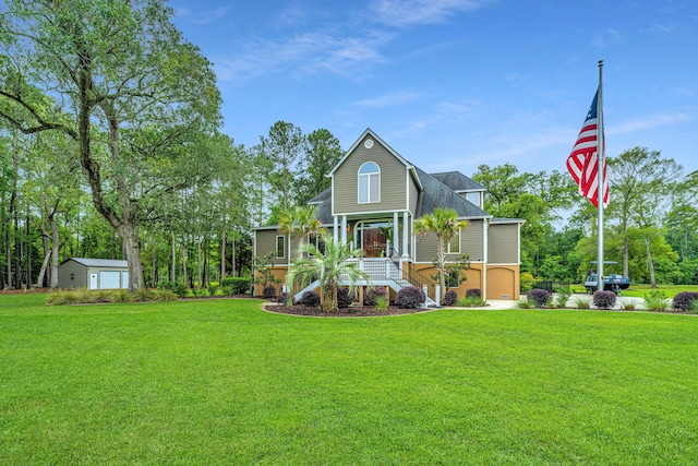 view of front of house featuring a garage, covered porch, and a front lawn