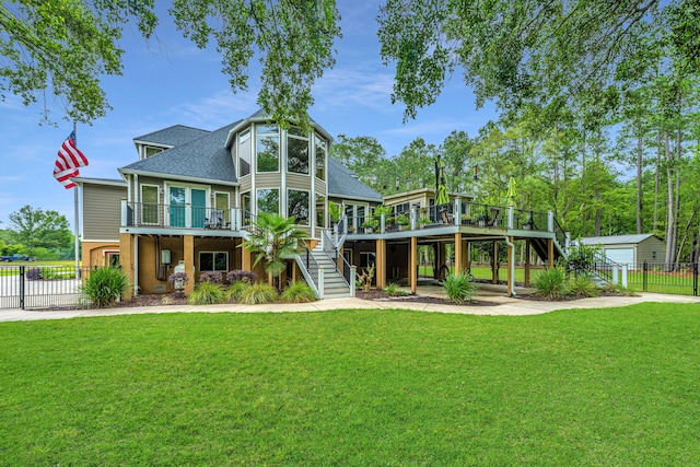 back of property featuring a yard and a deck