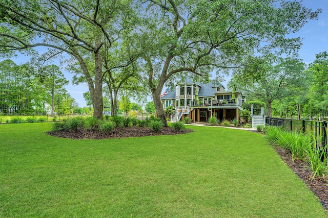 view of yard with a deck and a sunroom