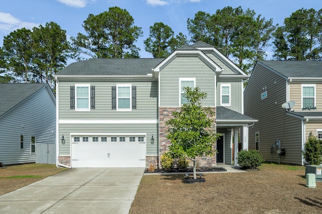 view of front of home with a garage and a front yard