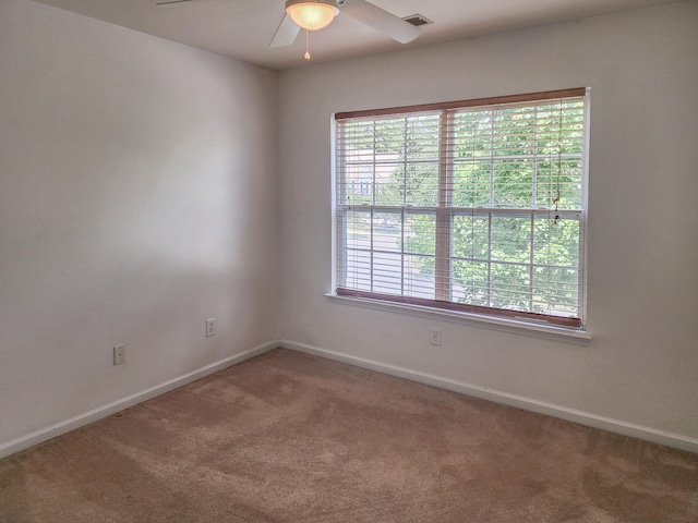 carpeted empty room with ceiling fan