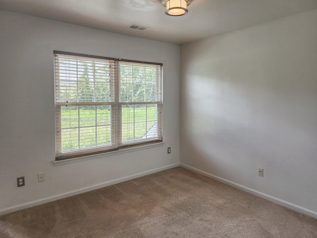 unfurnished room featuring carpet floors