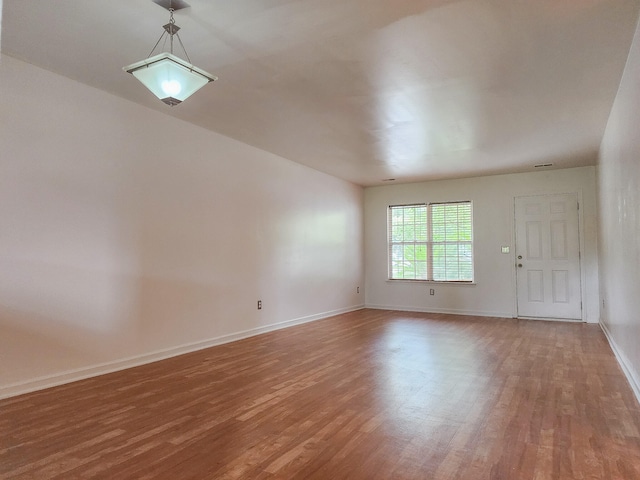 empty room featuring hardwood / wood-style flooring