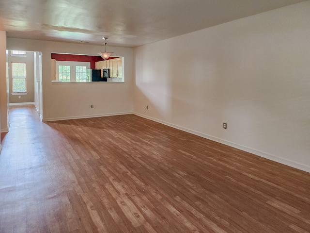 spare room with hardwood / wood-style flooring