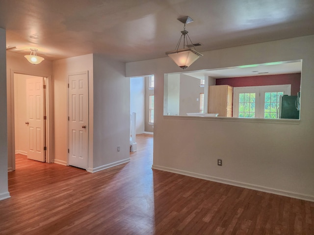 unfurnished room with hardwood / wood-style flooring