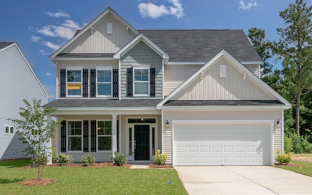 craftsman-style house featuring a garage and a front lawn