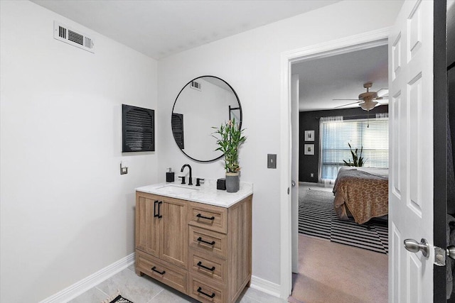 bathroom featuring vanity, tile patterned floors, and ceiling fan